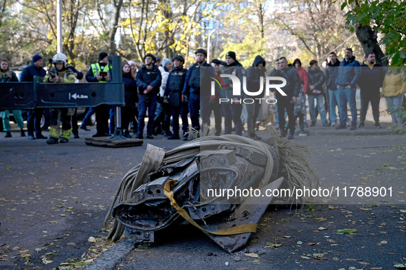 A fragment of a Russian missile is on the ground after being removed by State Emergency Service workers from a five-storey apartment buildin...