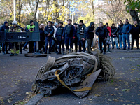 A fragment of a Russian missile is on the ground after being removed by State Emergency Service workers from a five-storey apartment buildin...