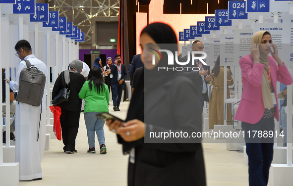 People arrive at the opening ceremony of the ROWAD Entrepreneurship Conference and the Arab SMEs Summit 2024 in Doha, Qatar, on November 18,...