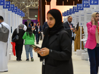 People arrive at the opening ceremony of the ROWAD Entrepreneurship Conference and the Arab SMEs Summit 2024 in Doha, Qatar, on November 18,...