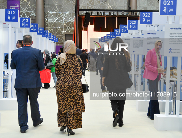 People arrive at the opening ceremony of the ROWAD Entrepreneurship Conference and the Arab SMEs Summit 2024 in Doha, Qatar, on November 18,...