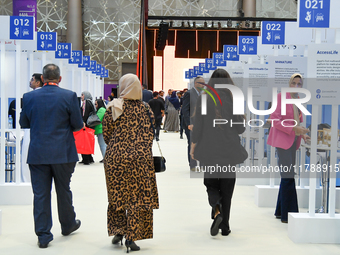 People arrive at the opening ceremony of the ROWAD Entrepreneurship Conference and the Arab SMEs Summit 2024 in Doha, Qatar, on November 18,...