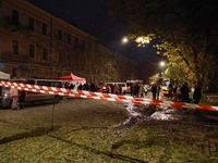 Emergency and rescue services stand by during a response effort to a fire in a three-story residential building caused by a Russian missile...