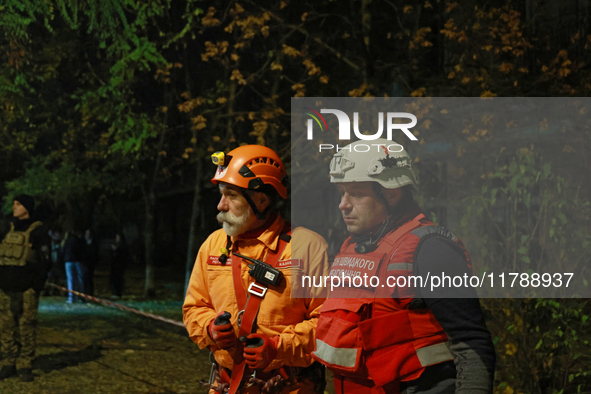 First responders participate in a response effort to a fire in a three-story residential building caused by a Russian missile and drone atta...