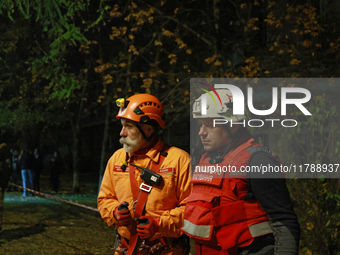 First responders participate in a response effort to a fire in a three-story residential building caused by a Russian missile and drone atta...