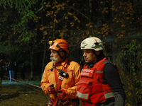 First responders participate in a response effort to a fire in a three-story residential building caused by a Russian missile and drone atta...