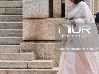 Sri Lankan Prime Minister Harini Amarasuriya walks to take a photograph with the newly appointed cabinet ministers at the president's office...