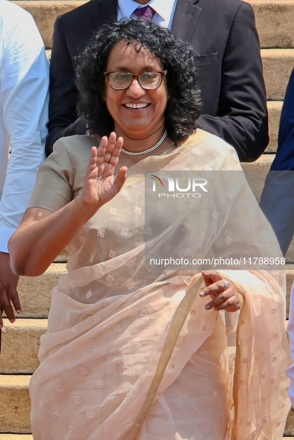 Sri Lankan Prime Minister Harini Amarasuriya gestures to the supporters with the newly appointed cabinet ministers at the president's office...