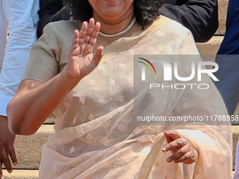 Sri Lankan Prime Minister Harini Amarasuriya gestures to the supporters with the newly appointed cabinet ministers at the president's office...