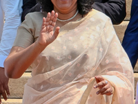 Sri Lankan Prime Minister Harini Amarasuriya gestures to the supporters with the newly appointed cabinet ministers at the president's office...