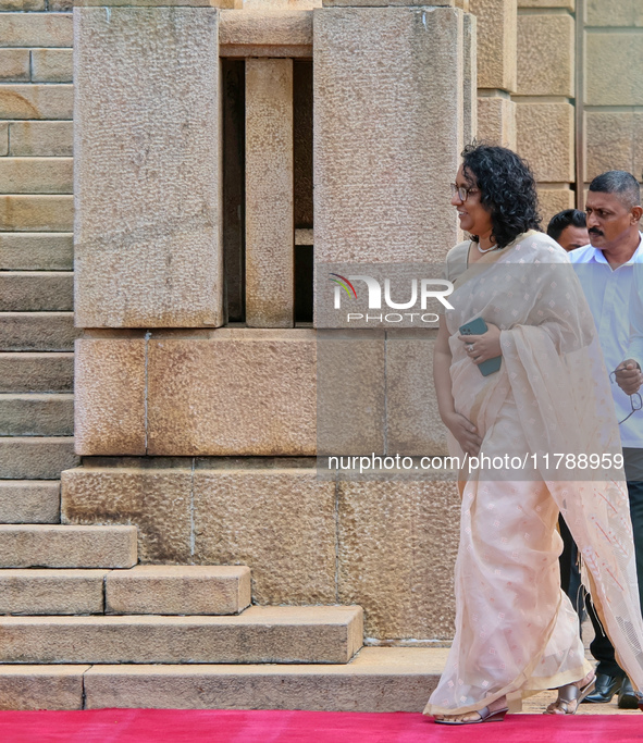 Sri Lankan Prime Minister Harini Amarasuriya walks to take a photograph with the newly appointed cabinet ministers at the president's office...