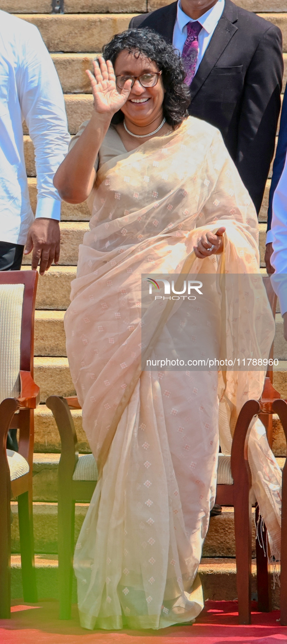 Sri Lankan Prime Minister Harini Amarasuriya gestures to the supporters with the newly appointed cabinet ministers at the president's office...