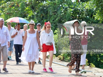 Tourists walk near Galle Face Green in Colombo, Sri Lanka, on November 18, 2024. (