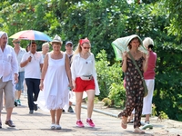 Tourists walk near Galle Face Green in Colombo, Sri Lanka, on November 18, 2024. (