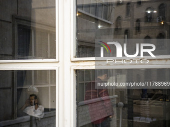 Two Iranian men are seen at a public library in downtown Tehran, Iran, on November 16, 2024. (