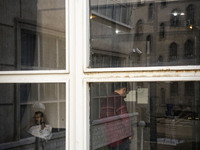 Two Iranian men are seen at a public library in downtown Tehran, Iran, on November 16, 2024. (