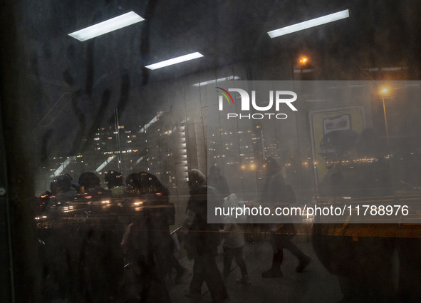 Iranian people walk through a corridor at an urban railway station in western Tehran, Iran, on November 17, 2024. 