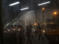 Iranian people walk through a corridor at an urban railway station in western Tehran, Iran, on November 17, 2024. (