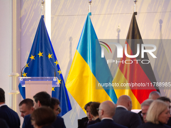 A general view of the flags of Europe, Ukraine, and Germany is seen before the Ukraine Conference of NRW at Flora Hall in Cologne, Germany,...