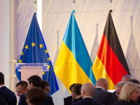 A general view of the flags of Europe, Ukraine, and Germany is seen before the Ukraine Conference of NRW at Flora Hall in Cologne, Germany,...