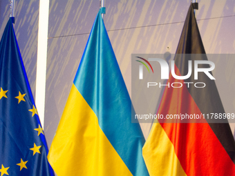 A general view of the flags of Europe, Ukraine, and Germany is seen before the Ukraine Conference of NRW at Flora Hall in Cologne, Germany,...