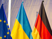 A general view of the flags of Europe, Ukraine, and Germany is seen before the Ukraine Conference of NRW at Flora Hall in Cologne, Germany,...