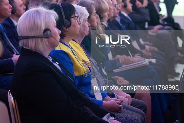 A general view shows people participating in the opening of the Ukraine Conference of NRW at Flora Hall in Cologne, Germany, on November 18,...