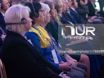 A general view shows people participating in the opening of the Ukraine Conference of NRW at Flora Hall in Cologne, Germany, on November 18,...