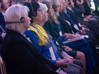 A general view shows people participating in the opening of the Ukraine Conference of NRW at Flora Hall in Cologne, Germany, on November 18,...