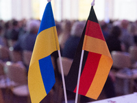 A general view of the flags of Ukraine and Germany is seen before the Ukraine Conference of NRW at Flora Hall in Cologne, Germany, on Novemb...