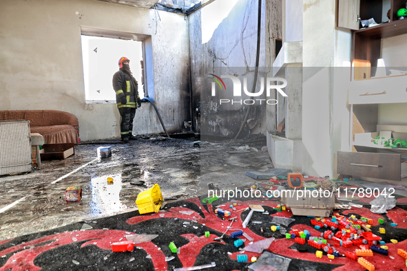 A firefighter stands in a living room in a house damaged by a large-scale Russian missile strike in the Odesa region, Ukraine, on November 1...