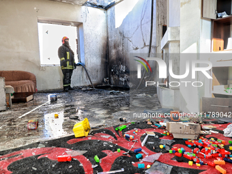 A firefighter stands in a living room in a house damaged by a large-scale Russian missile strike in the Odesa region, Ukraine, on November 1...