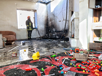 A firefighter stands in a living room in a house damaged by a large-scale Russian missile strike in the Odesa region, Ukraine, on November 1...