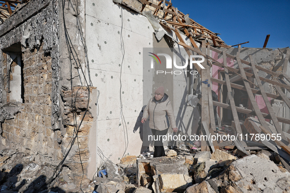 In the Odesa region, Ukraine, on November 17, 2024, a woman walks along a house destroyed by a large-scale Russian missile strike. In the re...