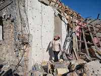 In the Odesa region, Ukraine, on November 17, 2024, a woman walks along a house destroyed by a large-scale Russian missile strike. In the re...