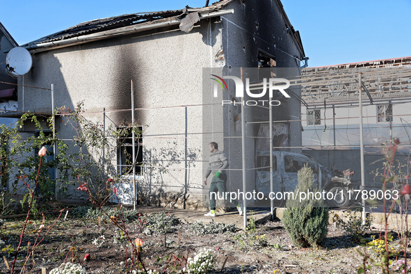 In the Odesa region, Ukraine, on November 17, 2024, a man walks along a house damaged by a large-scale Russian missile strike. In the recent...