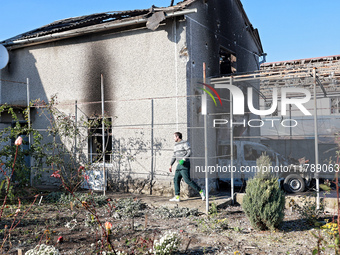 In the Odesa region, Ukraine, on November 17, 2024, a man walks along a house damaged by a large-scale Russian missile strike. In the recent...