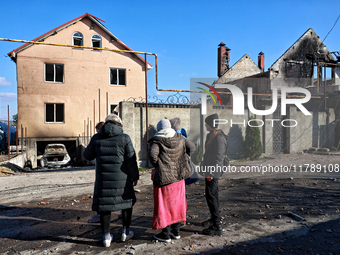 In the Odesa region, Ukraine, on November 17, 2024, people look at a house damaged by a large-scale Russian missile strike. In the recent ma...