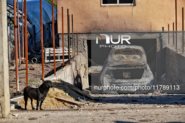 A burnt-out car is in a garage in a house damaged by a large-scale Russian missile strike in Odesa region, Ukraine, on November 17, 2024. In...