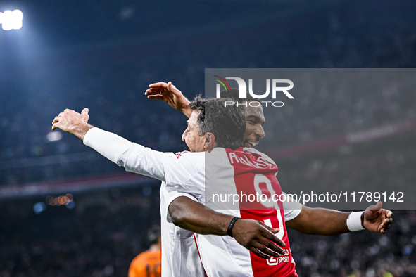 Supporters of AFC Ajax Amsterdam and AFC Ajax Amsterdam legend player Ryan Babel celebrate the goal during the match between Ajax Legends an...