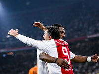 Supporters of AFC Ajax Amsterdam and AFC Ajax Amsterdam legend player Ryan Babel celebrate the goal during the match between Ajax Legends an...