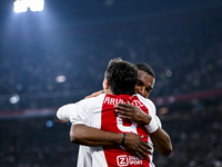 Supporters of AFC Ajax Amsterdam and AFC Ajax Amsterdam legend player Ryan Babel celebrate the goal during the match between Ajax Legends an...