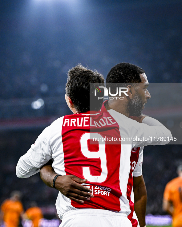 Supporters of AFC Ajax Amsterdam and AFC Ajax Amsterdam legend player Ryan Babel celebrate the goal during the match between Ajax Legends an...