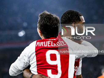 Supporters of AFC Ajax Amsterdam and AFC Ajax Amsterdam legend player Ryan Babel celebrate the goal during the match between Ajax Legends an...