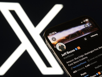 An editorial image shows an iPhone screen with Jeff Bezos's personal account displayed on the X social network platform. The X logo appears...