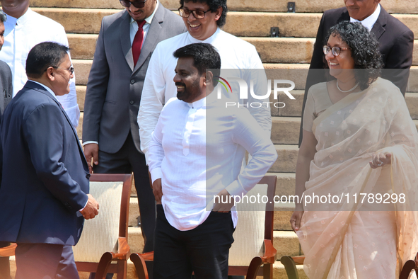 Sri Lankan President Anura Kumara Dissanayake speaks to Minister Vijitha Herath as Prime Minister Harini Amarasuriya looks on with newly app...