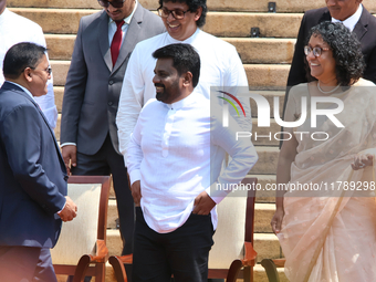 Sri Lankan President Anura Kumara Dissanayake speaks to Minister Vijitha Herath as Prime Minister Harini Amarasuriya looks on with newly app...