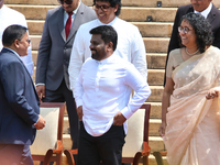 Sri Lankan President Anura Kumara Dissanayake speaks to Minister Vijitha Herath as Prime Minister Harini Amarasuriya looks on with newly app...