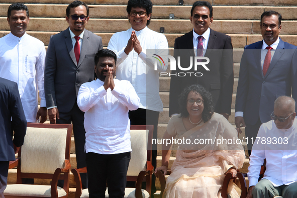 Sri Lankan President Anura Kumara Dissanayake acknowledges the supporters as Prime Minister Harini Amarasuriya looks on with newly appointed...