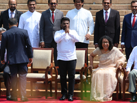 Sri Lankan President Anura Kumara Dissanayake acknowledges the supporters as Prime Minister Harini Amarasuriya looks on with newly appointed...